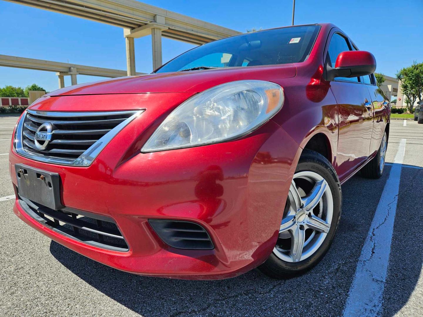 2012 Red /Black Nissan Versa (3N1CN7AP8CL) , located at 5005 Telephone Rd., Houston, TX, 77087, (713) 641-0980, 29.690666, -95.298683 - Photo#0